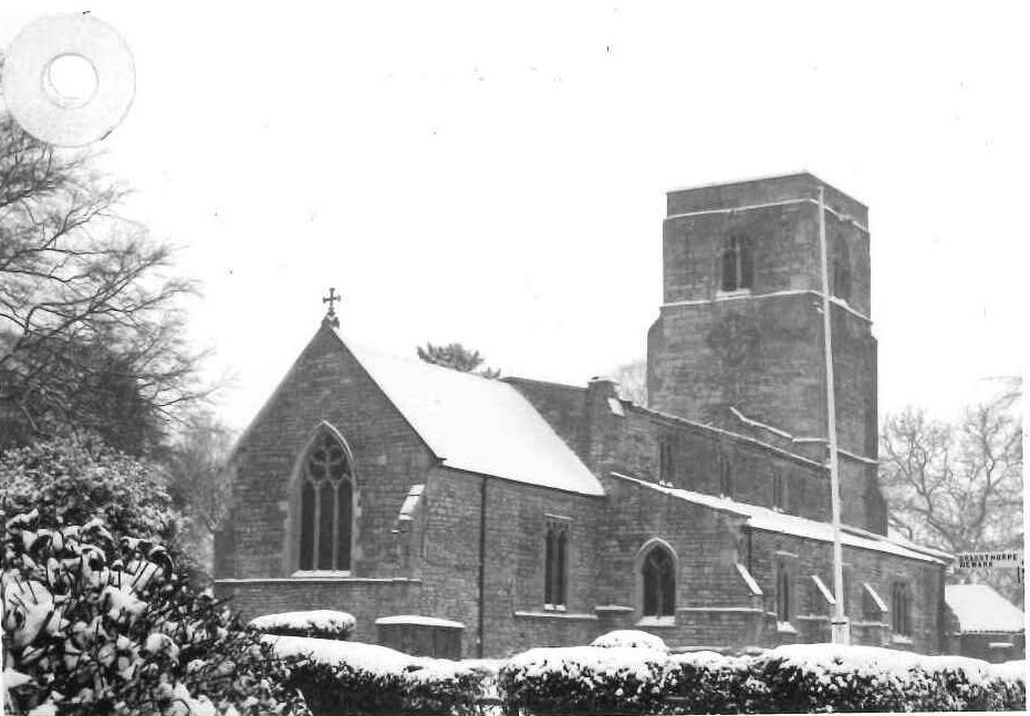 church with flat roofed square tower in snow