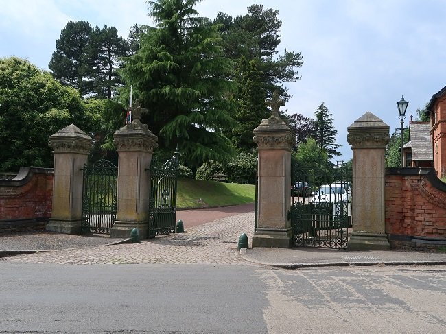 stone gateposts with large iron gates 