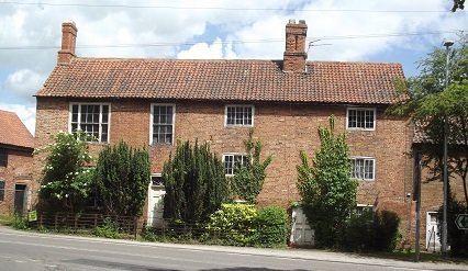 row of red brick cottages