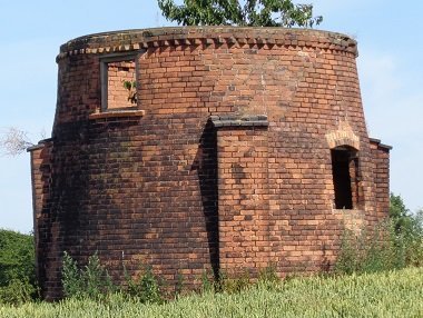 round red brick building with no roof