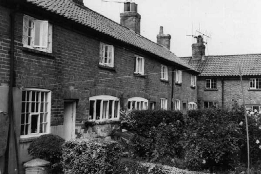 Black and white photo of ow of houses- Windles Square