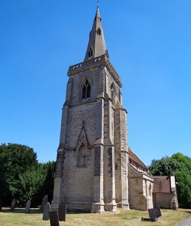 grey church with tall pointed tower